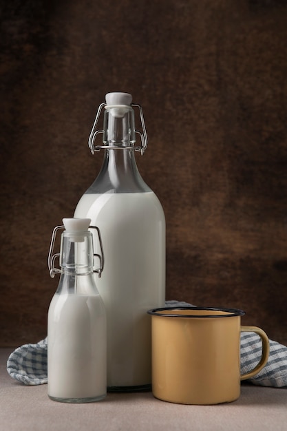 Free photo bottles of milk arrangement still life