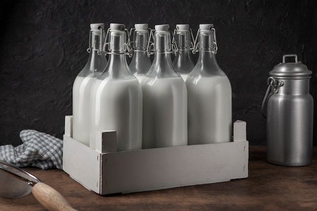 Free photo bottles of milk arrangement still life