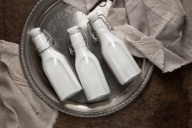 Free photo bottles of milk arrangement still life