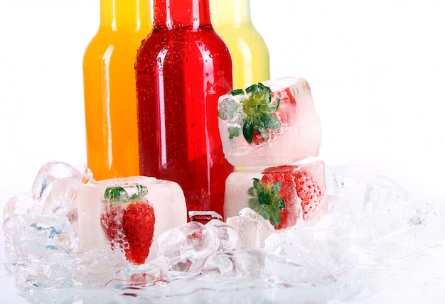 Free photo bottles with colorful cocktail and ice