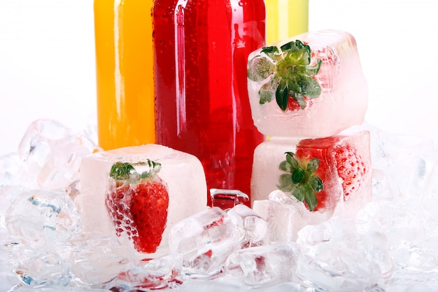 Free Photo bottles with colorful cocktail and ice