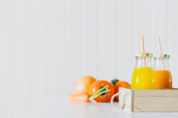 Bottles with juice in box