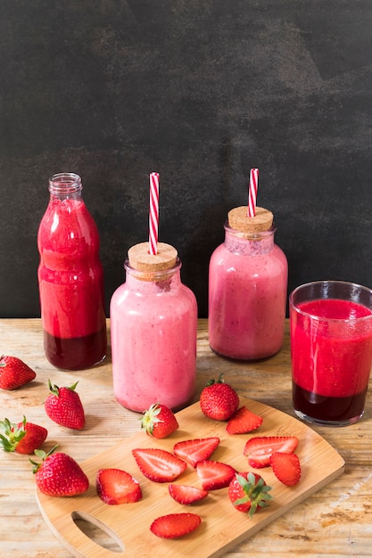 Bottles with strawberry smoothie