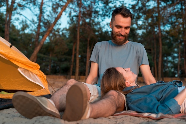 Free photo bottom view camping couple