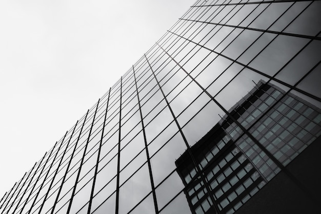 Bottom view glass building with reflection