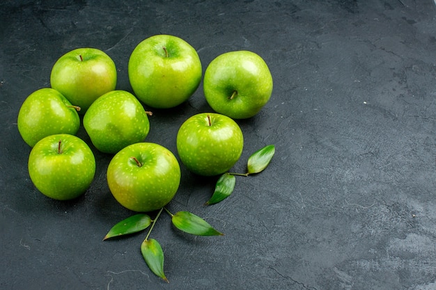 Bottom view green apples on dark surface free spacebottom view green apples on dark surface