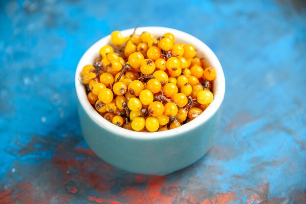 Bottom view sea buckthorn on blue table