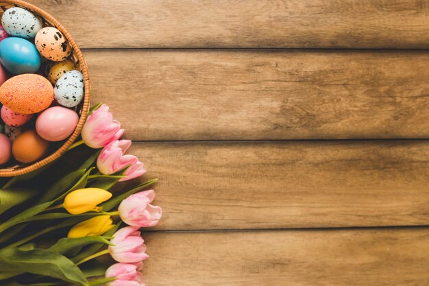 Bouquet near bowl with eggs