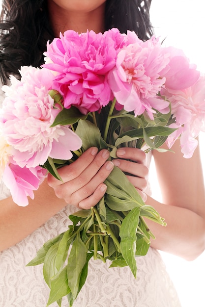 Free Photo bouquet of peonies in woman's hands