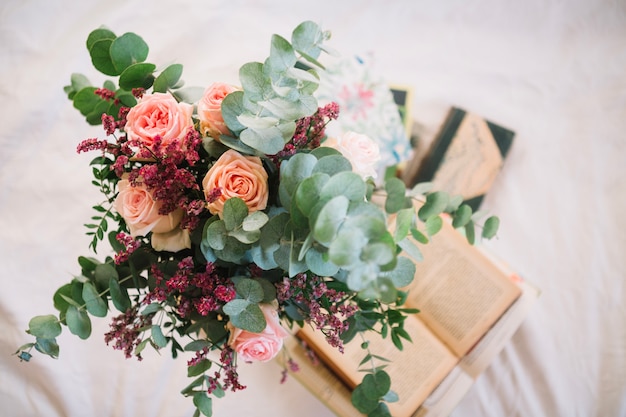 Bouquet standing on books