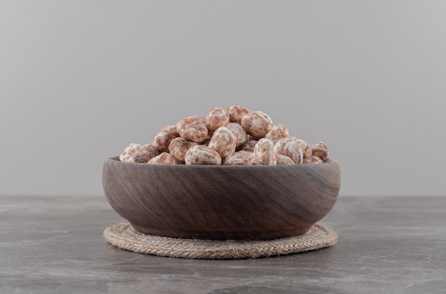 Free Photo a bowl of confectionery on the marble surface