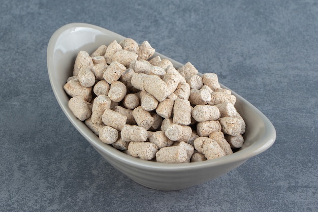 A bowl full of rye crispy cereals .