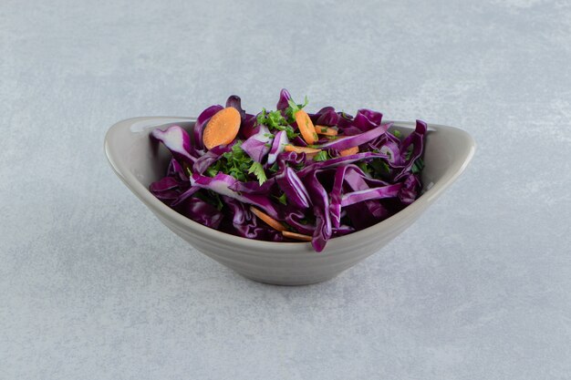 A bowl of grated vegetables, on the marble.