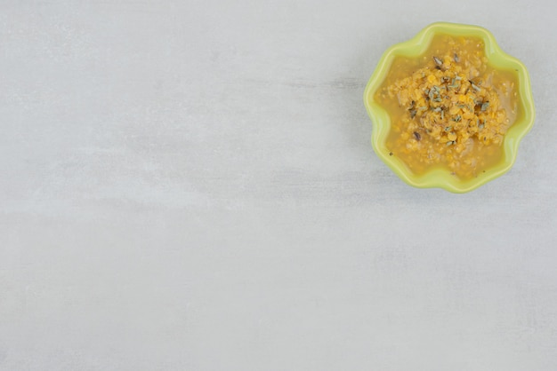 Bowl of homemade soup on white.