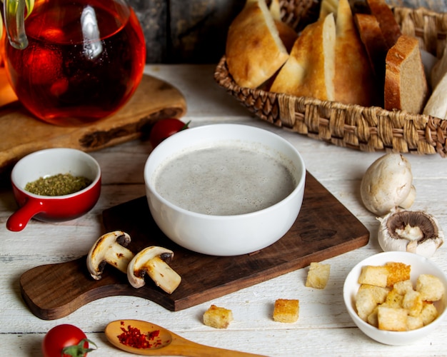 bowl of mushroom soup served with bread stuffing