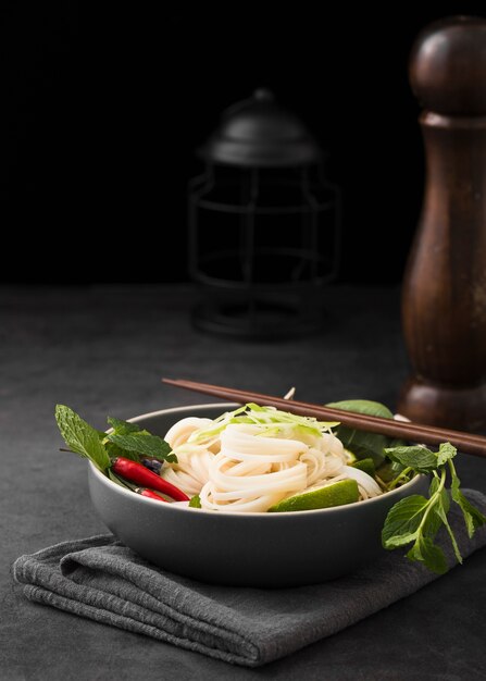 Bowl of noodles with chopsticks and copy space