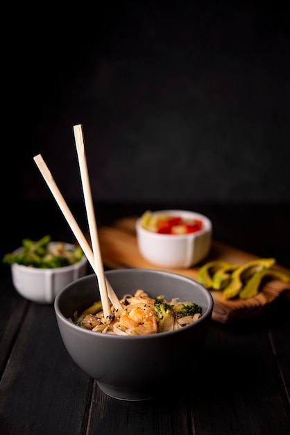 Bowl of noodles with chopsticks and shrimp