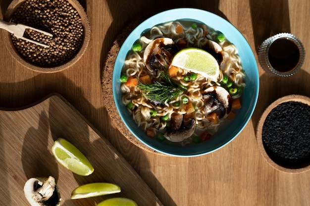 Bowl of ramen with seeds and sliced lemon