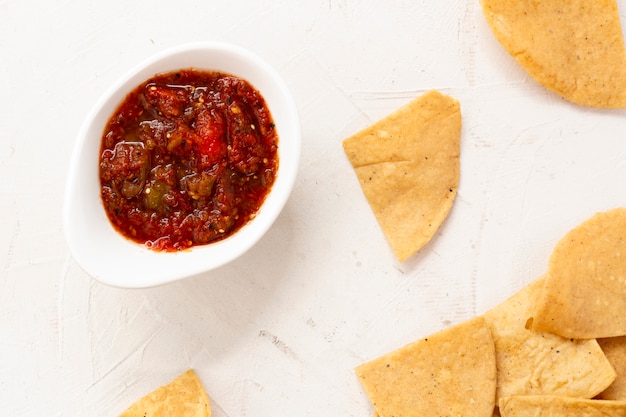 Bowl of sauce with nacho chips