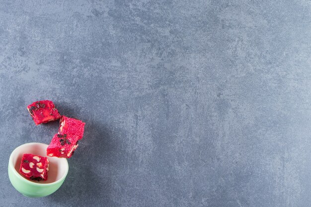 A bowl of sweet Turkish delights , on the marble background.