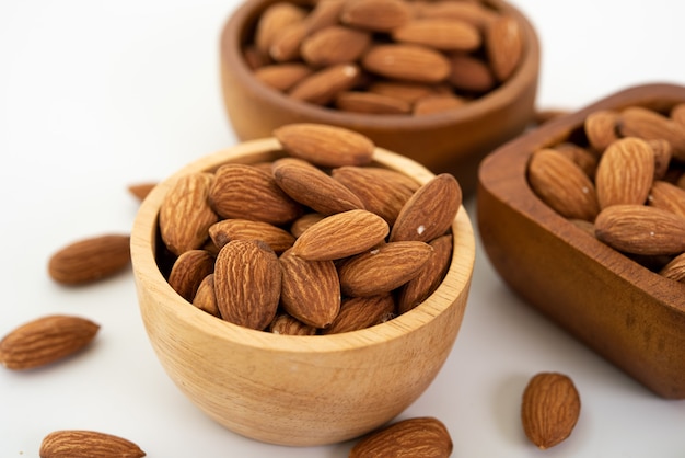 Free photo bowl with almond on on white background. top view.