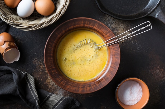 Bowl with eggs yolk for omlette