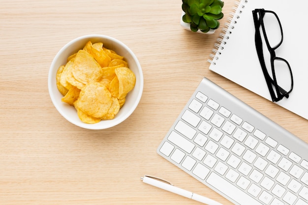 Bowl with potato chips on office