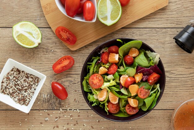 Bowl with salad on table