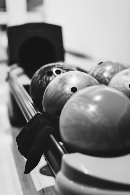 Free photo bowling balls lined at the bowling alley