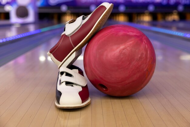 Bowling balls and shoes arrangement