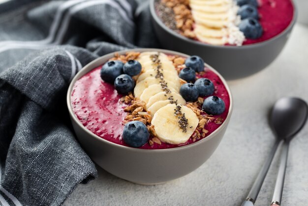 Bowls with breakfast desserts and blueberries