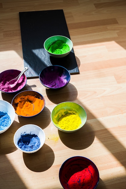 Free photo bowls with bright dry colors on floor