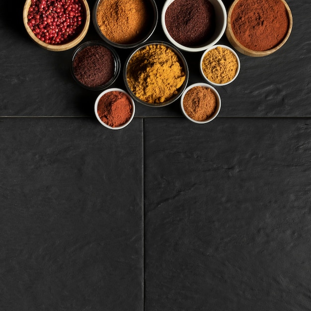 Bowls with condiments and copy-space