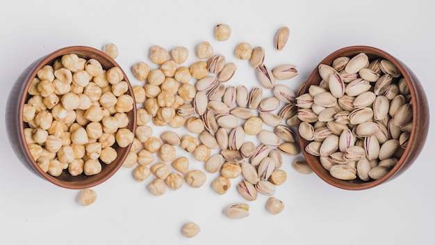 Bowls with pistachios and hazelnuts