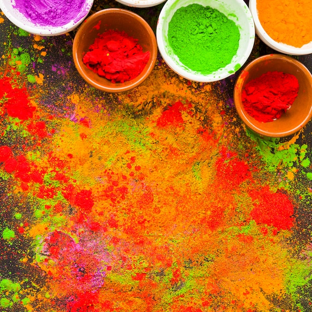 Free photo bowls with scattered powder on table