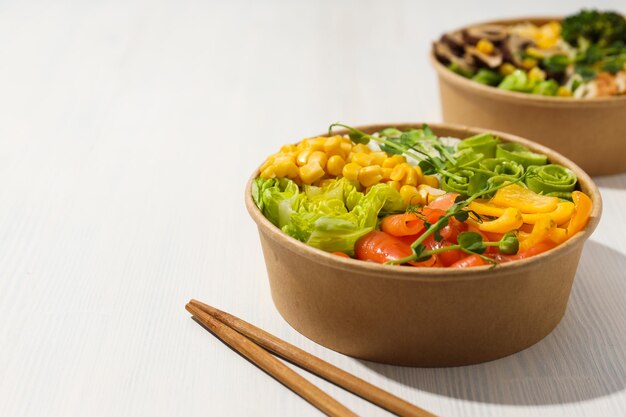 Bowls with tasty and nutritious food space for text