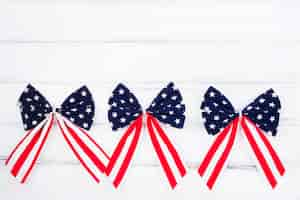 Free photo bows of ribbons with symbols of american flag