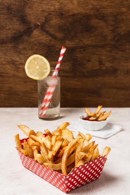 Box of french fries on white table