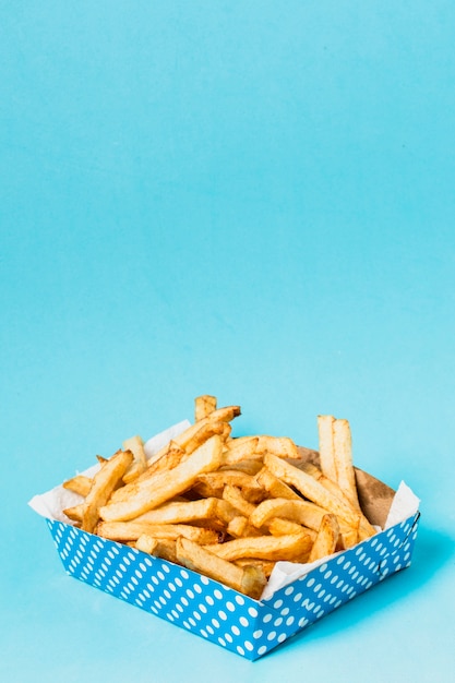 Free photo box of fries with copy space