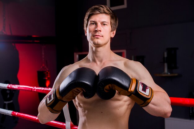 Boxer boy posing at the gym