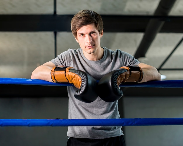 Free Photo boxer boy posing at the gym