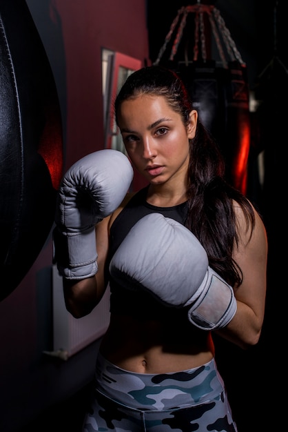 Boxer girl posing at the gym