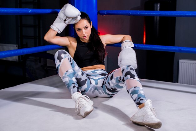 Boxer girl posing at the gym