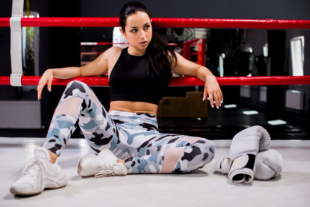 Boxer girl posing at the gym