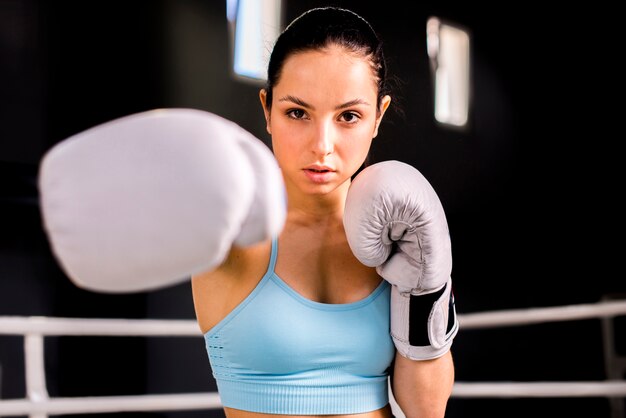 Boxer girl posing at the gym