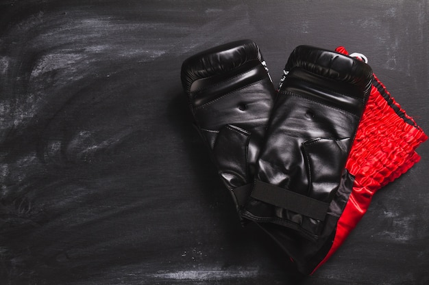 Free photo boxing gloves on slate surface