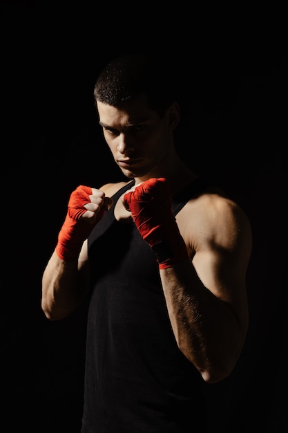 Free photo boxing male standing in a rack