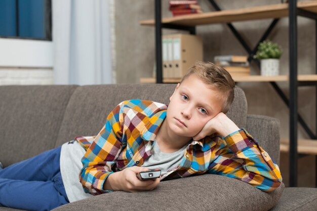 Boy bored on couch