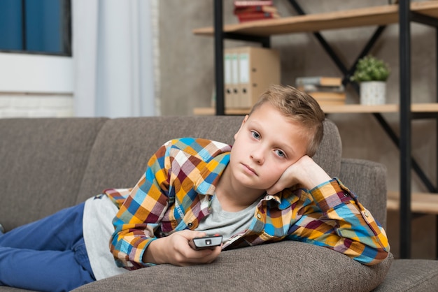 Boy bored on couch