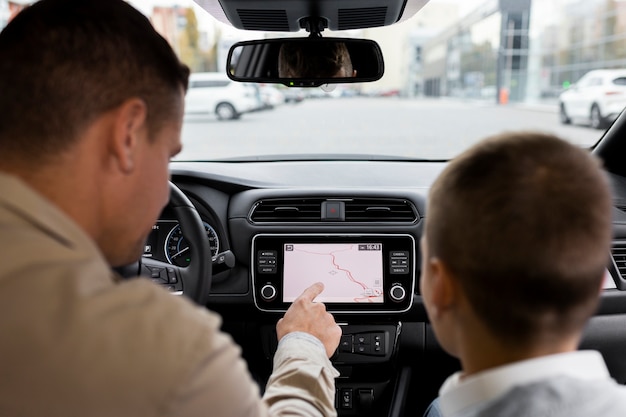 Boy and dad near an electric car